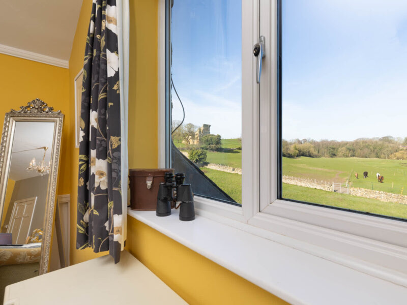 Country views from East Wing holiday let, with binoculars ready for spotting wildlife.