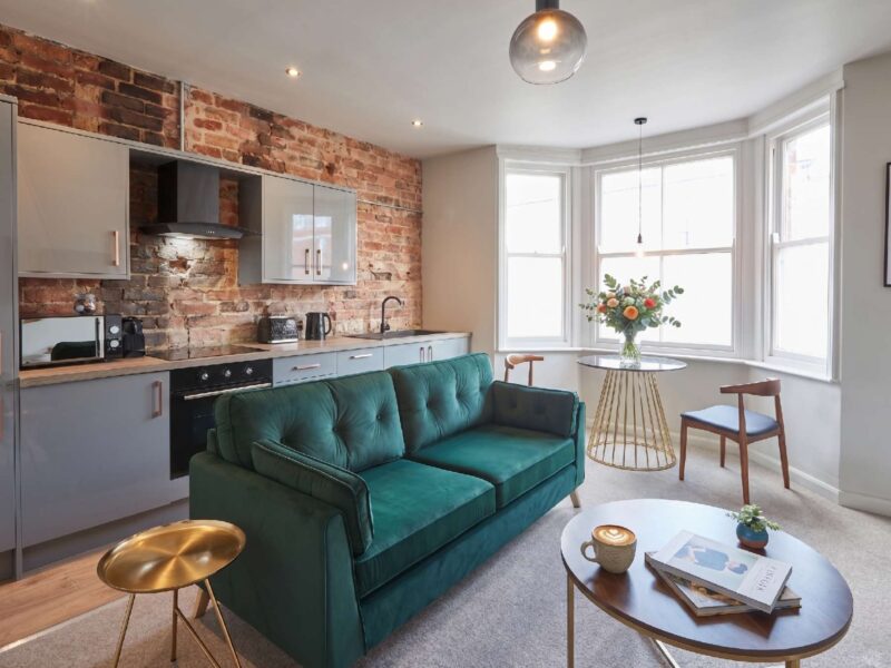 Stylish living area with kitchen at Umpires Watch Cricket View holiday let.