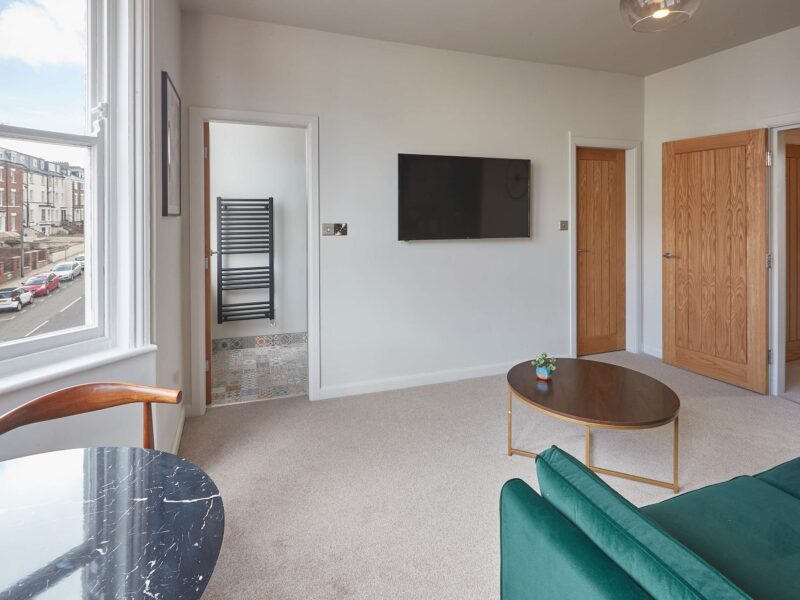Living area with street view at Umpires Watch Cricket View holiday let.