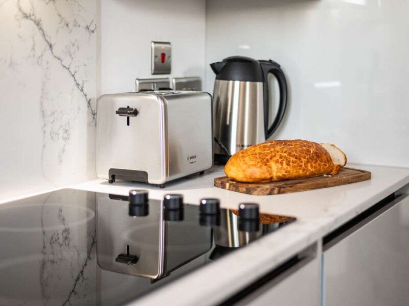 Kitchenette with toaster, kettle, and bread at Albemarle Chambers.