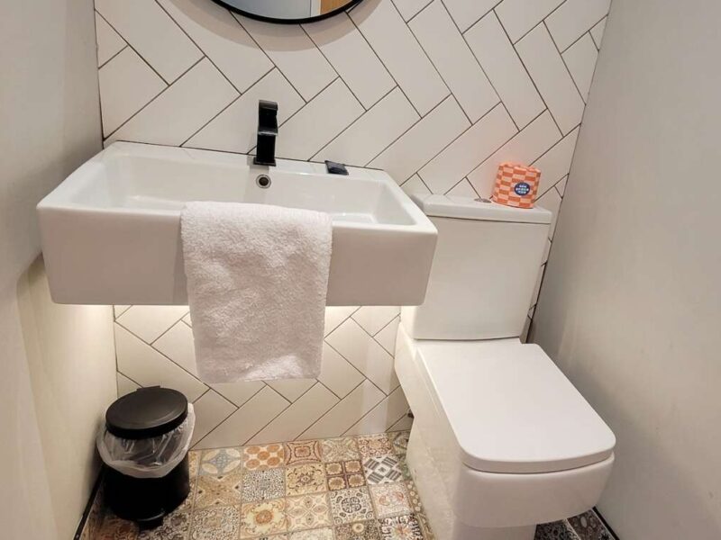 Modern bathroom with sink and toilet at Umpires Watch, Cricket View.