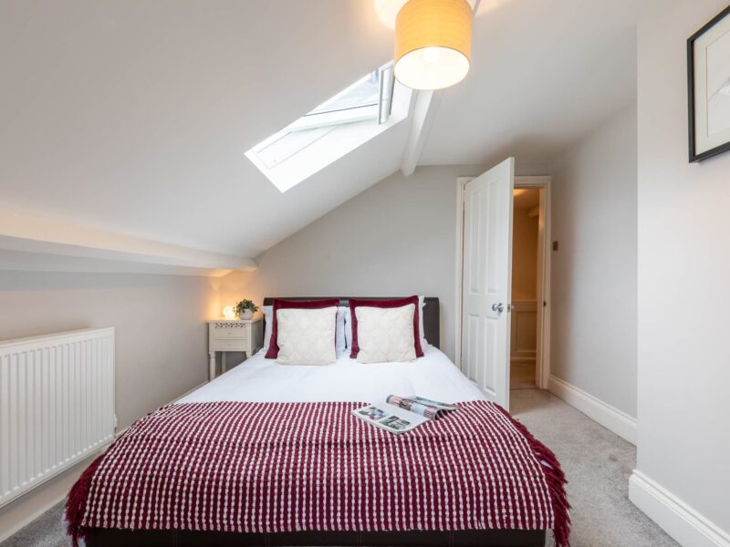 Cozy bedroom with skylight at Malton Luxury Retreat, sleeps 10.