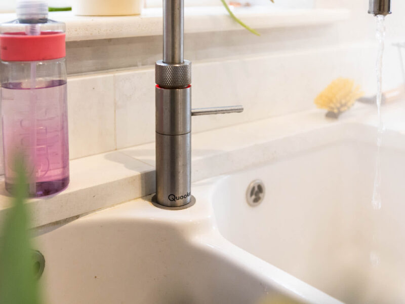 Modern kitchen sink with running water at Malton Luxury Retreat.