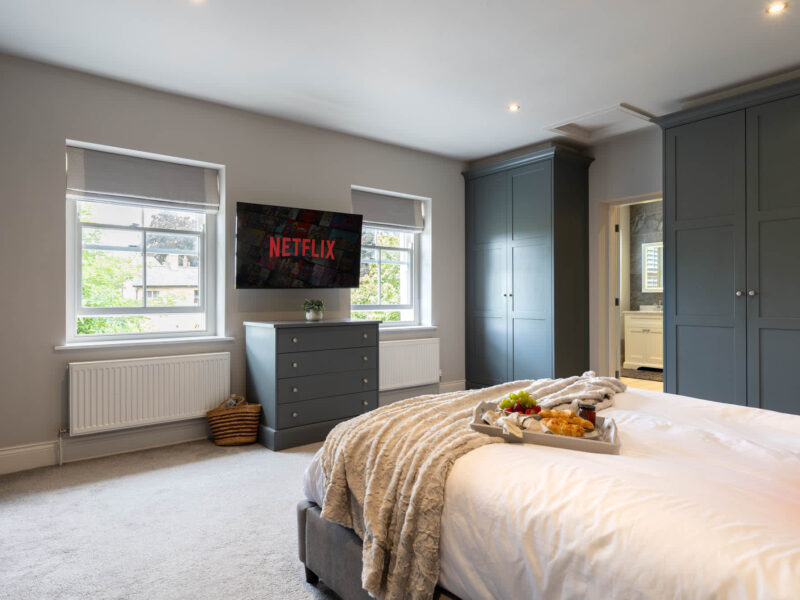 Luxury bedroom with Netflix TV and breakfast tray at Malton Retreat.