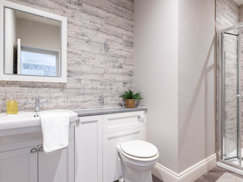 Modern bathroom with shower and vanity at Malton Luxury Retreat.