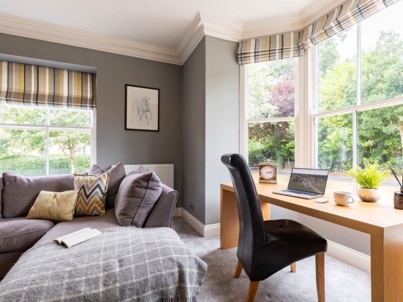 Comfortable living area and workspace at Malton Luxury Retreat.