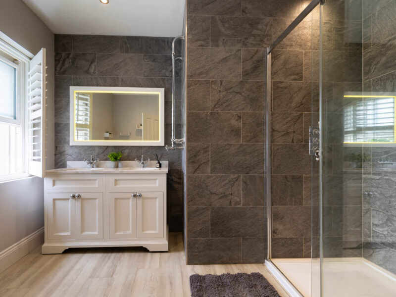 Luxury bathroom with double vanity and walk-in shower at Malton Retreat.
