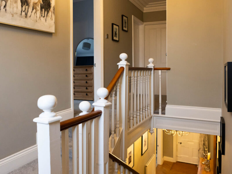 Elegant staircase and hallway at Malton Luxury Retreat, sleeps 10.