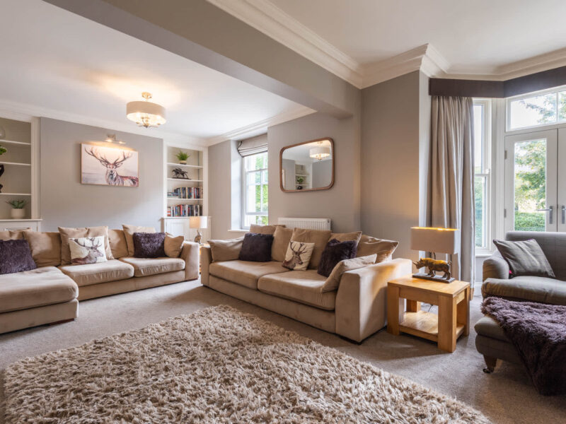 Spacious living area with plush sofas at Malton Luxury Retreat.