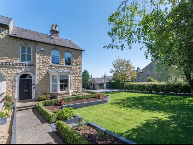 Malton Luxury Retreat: Stone facade holiday home with manicured gardens.