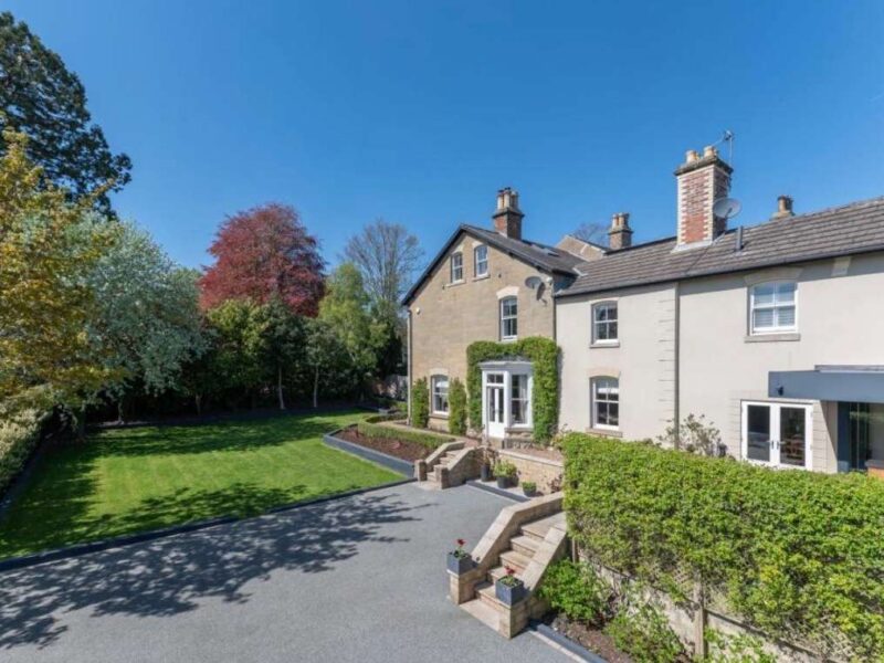 Malton Luxury Retreat: elegant property with manicured gardens and driveway.